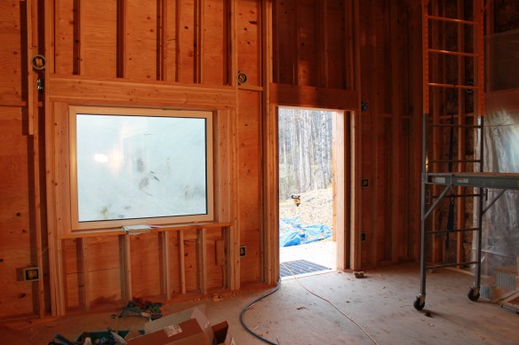 There are three layers of insulation in the walls. This is looking south from the kitchen to the living area and front door.